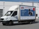 LKW Werbebanner für VHS in Wien
